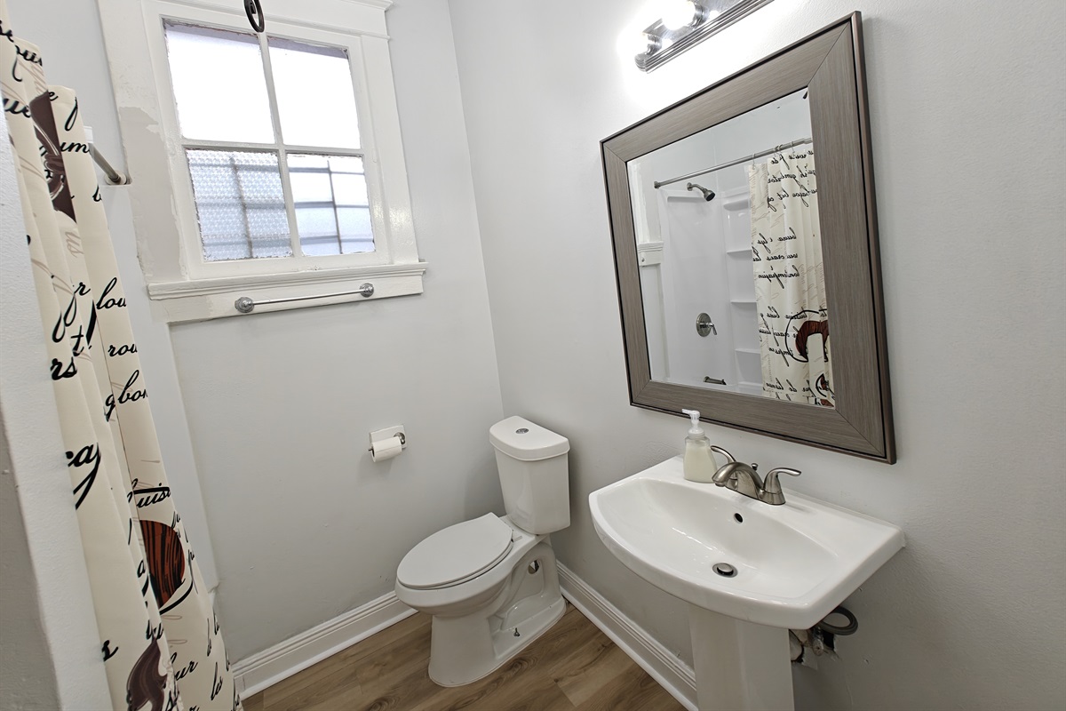 Hallway bathroom. Full shower/tub. 