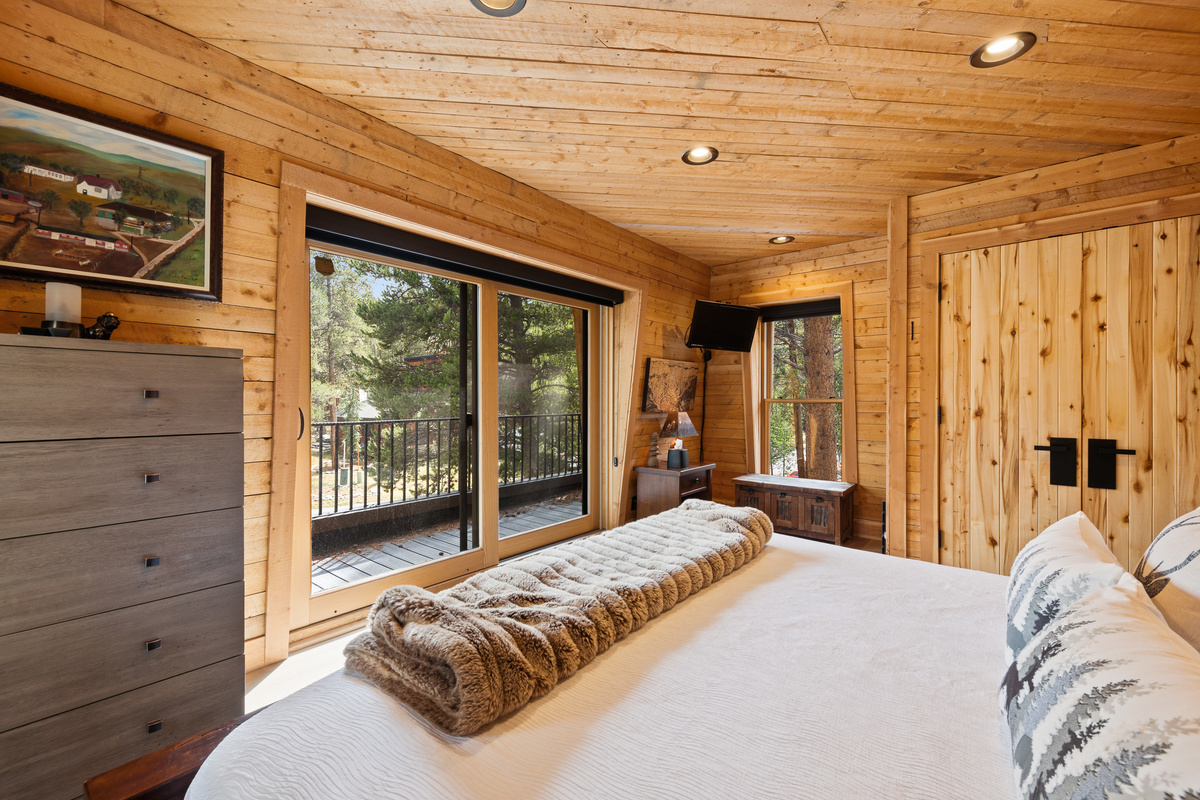 Upper level junior suite with King bed and private balcony