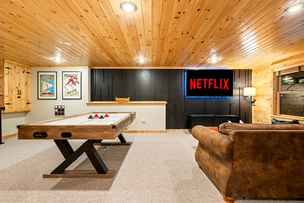 The lower level is all about fun—game room, second living area, and a space just for the kids.