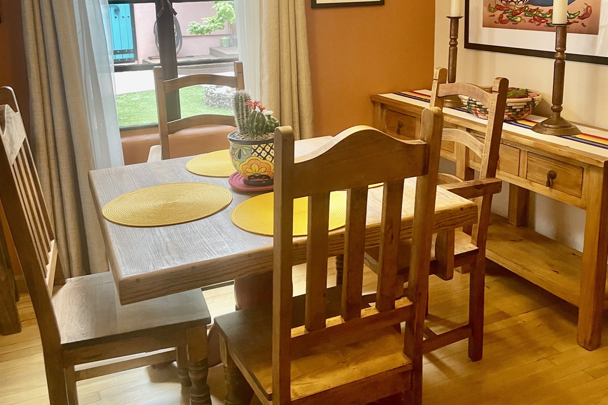 A cozy dining space with a classic wooden table and southwestern accents.