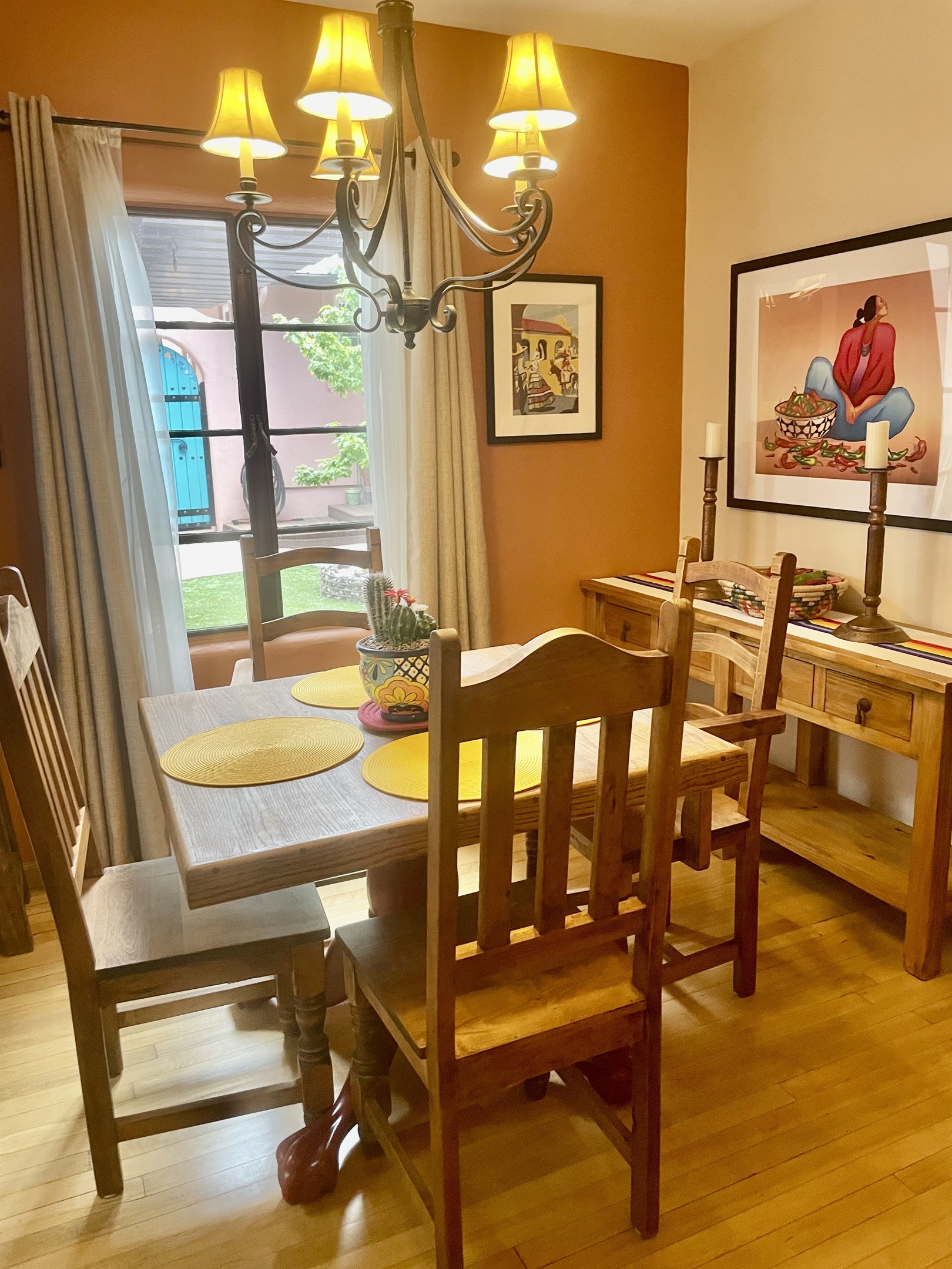 A cozy dining space with a classic wooden table and southwestern accents.