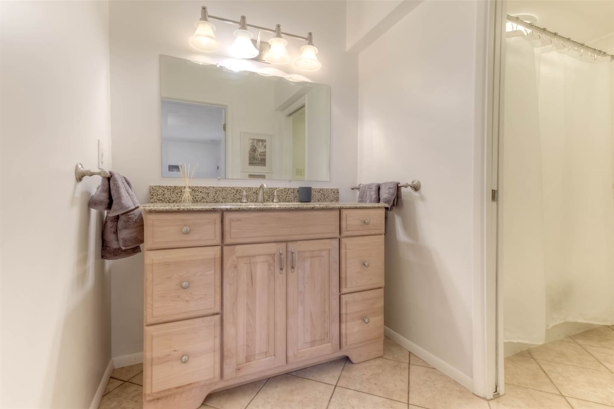 ensuite bathroom with separate sink area