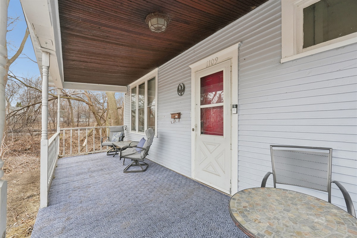 The front porch offers two casual seating nooks for morning coffee, or for watching cute puppies on walks across the cul-de-sac and tiny city park, or watching the nearby trains.