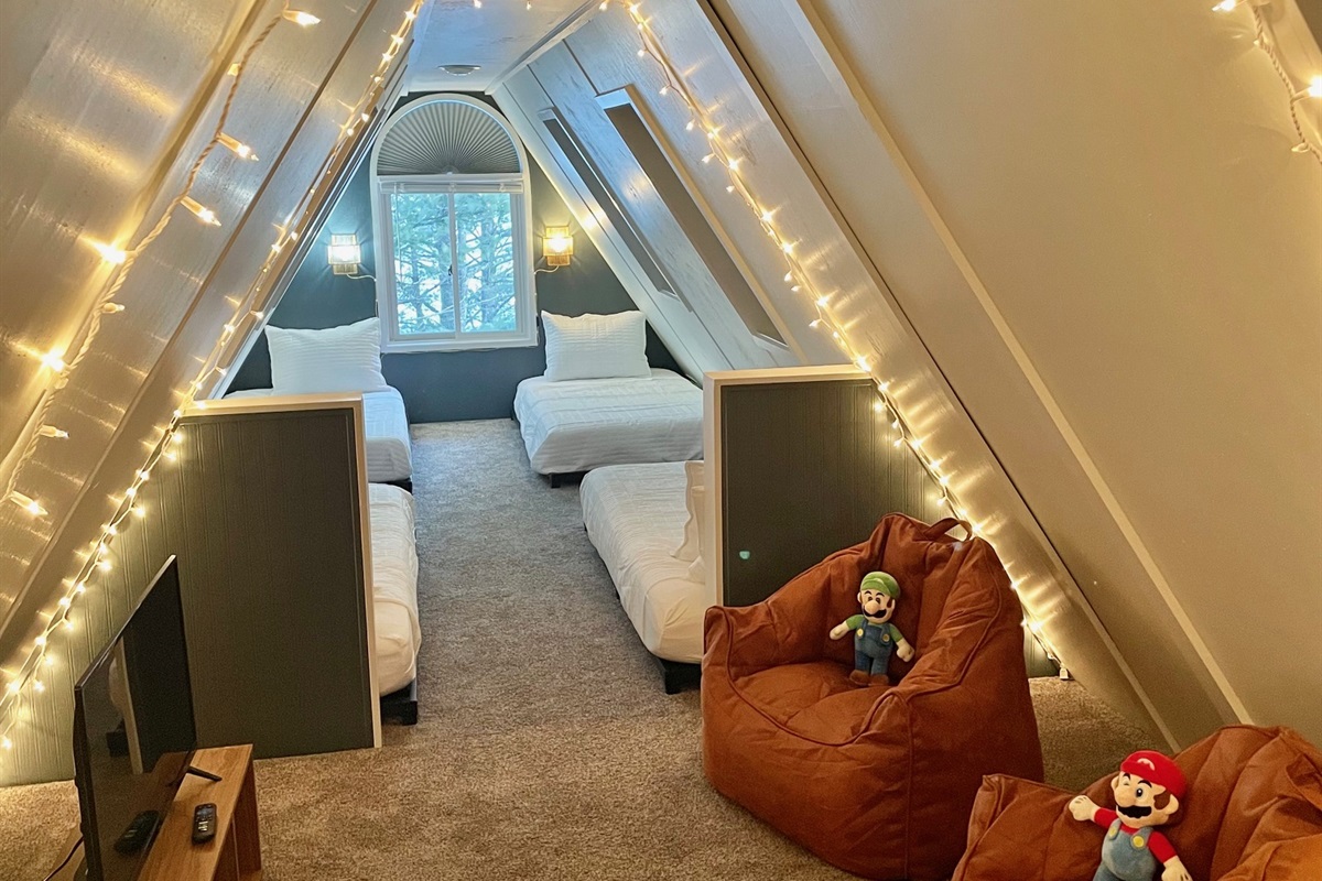 Four twin beds and kids gaming area (BYO console)