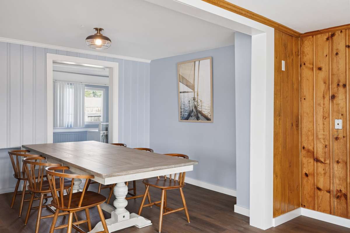 Pull every chair in and seat all ten around the dining table — group dinner the way it should be, nobody in shifts, everyone together.