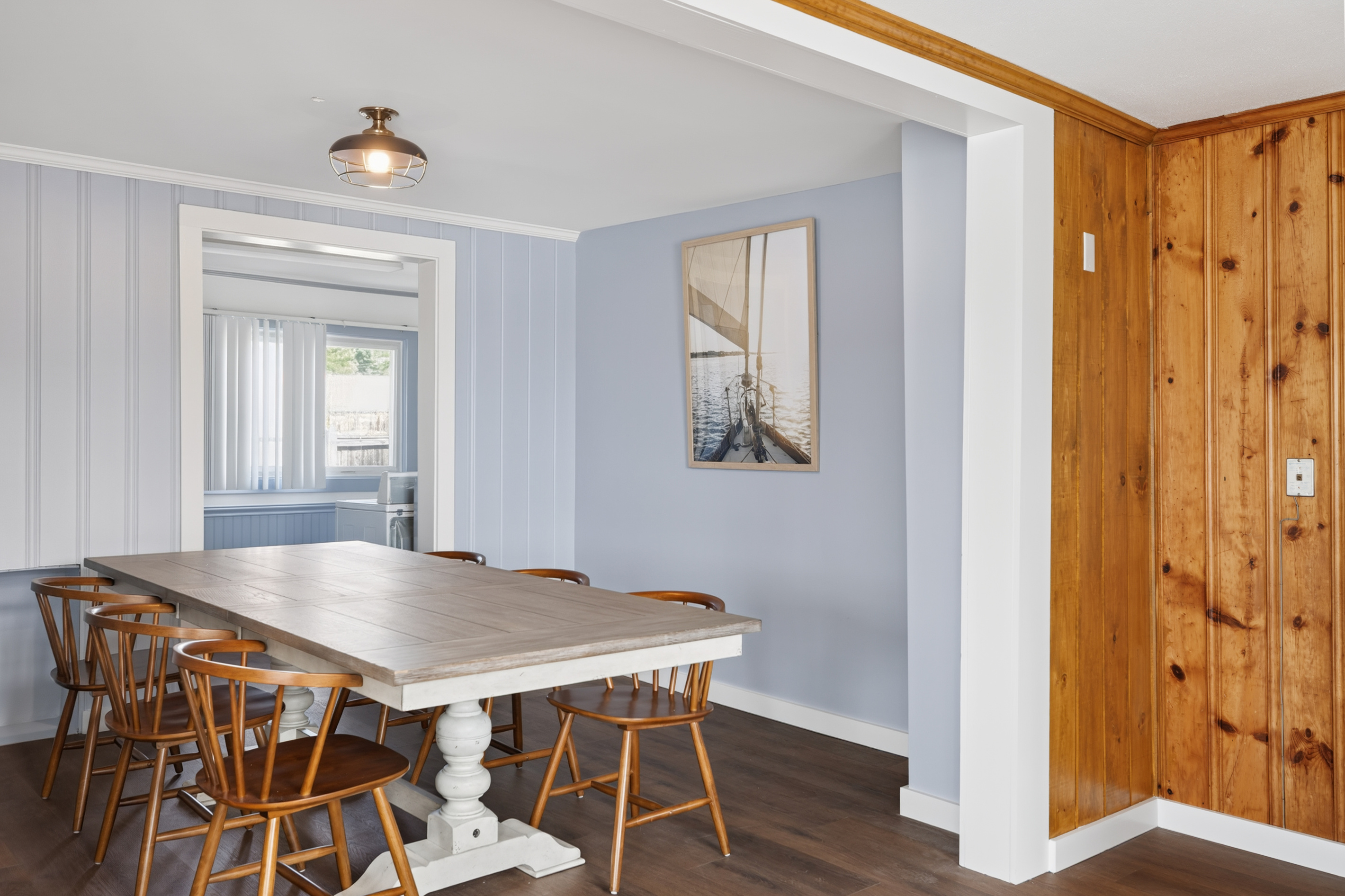 Pull every chair in and seat all ten around the dining table — group dinner the way it should be, nobody in shifts, everyone together.