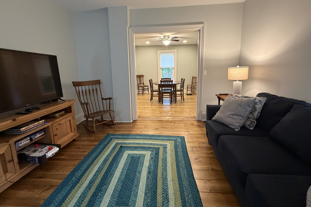Living room with SmartTV and assorted games and books