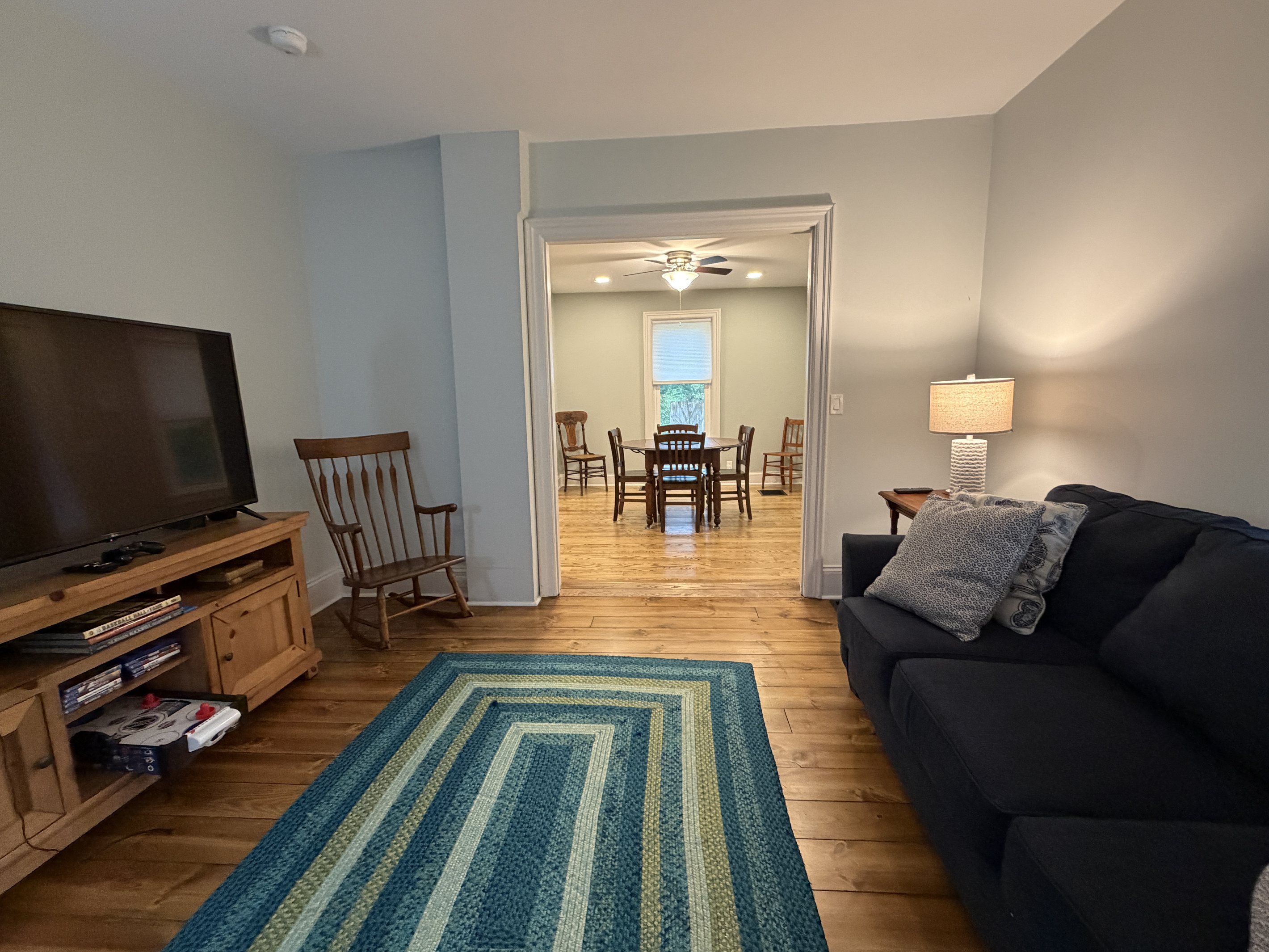 Living room with SmartTV and assorted games and books