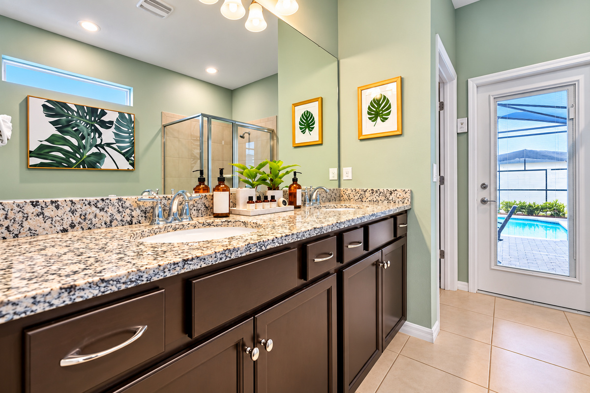 The master suite bathroom has double sinks and plenty of counter space for all your face routine products. IYKYK