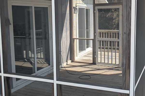 The screened in porch on the back deck will be a perfect place to enjoy the outdoors without worrying about bugs!