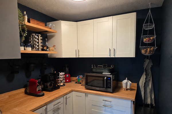 Well-stocked pantry and coffee bar with extra storage, small appliances and grab-and-go convenience.