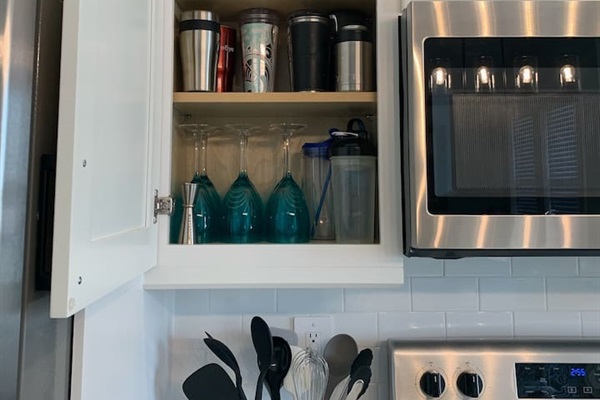 Assortment of insulated cups and additional wine glasses.  