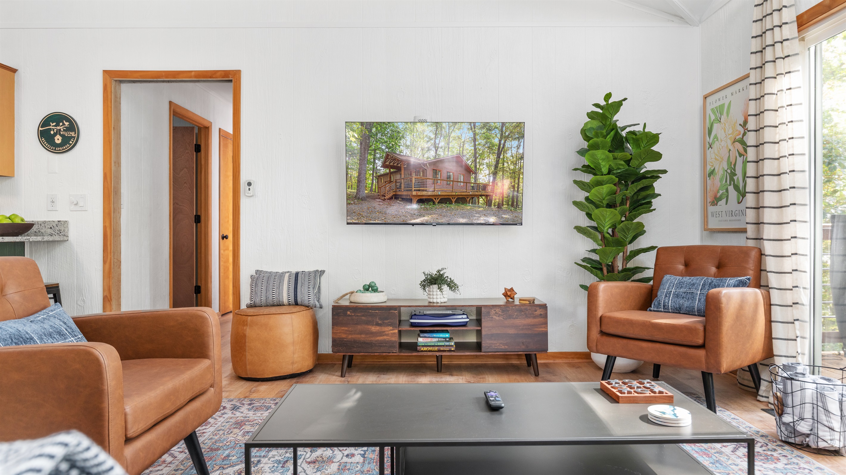 Kick back and connect—comfy seating and TV make this the perfect gathering spot