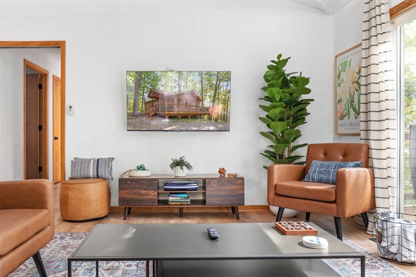 Kick back and connect—comfy seating and TV make this the perfect gathering spot