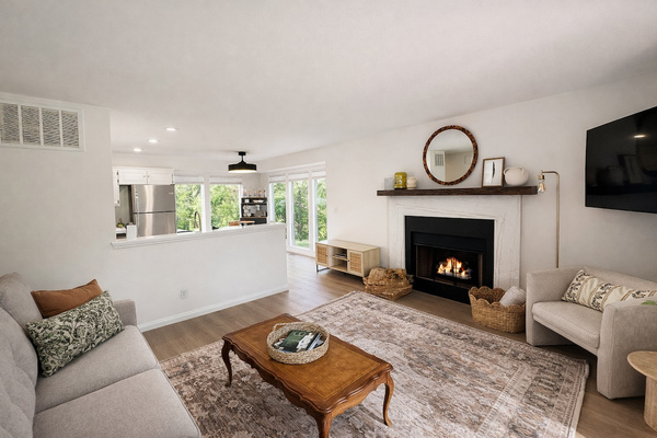 A warm living room centered around the fireplace — perfect for cool Bentonville evenings.