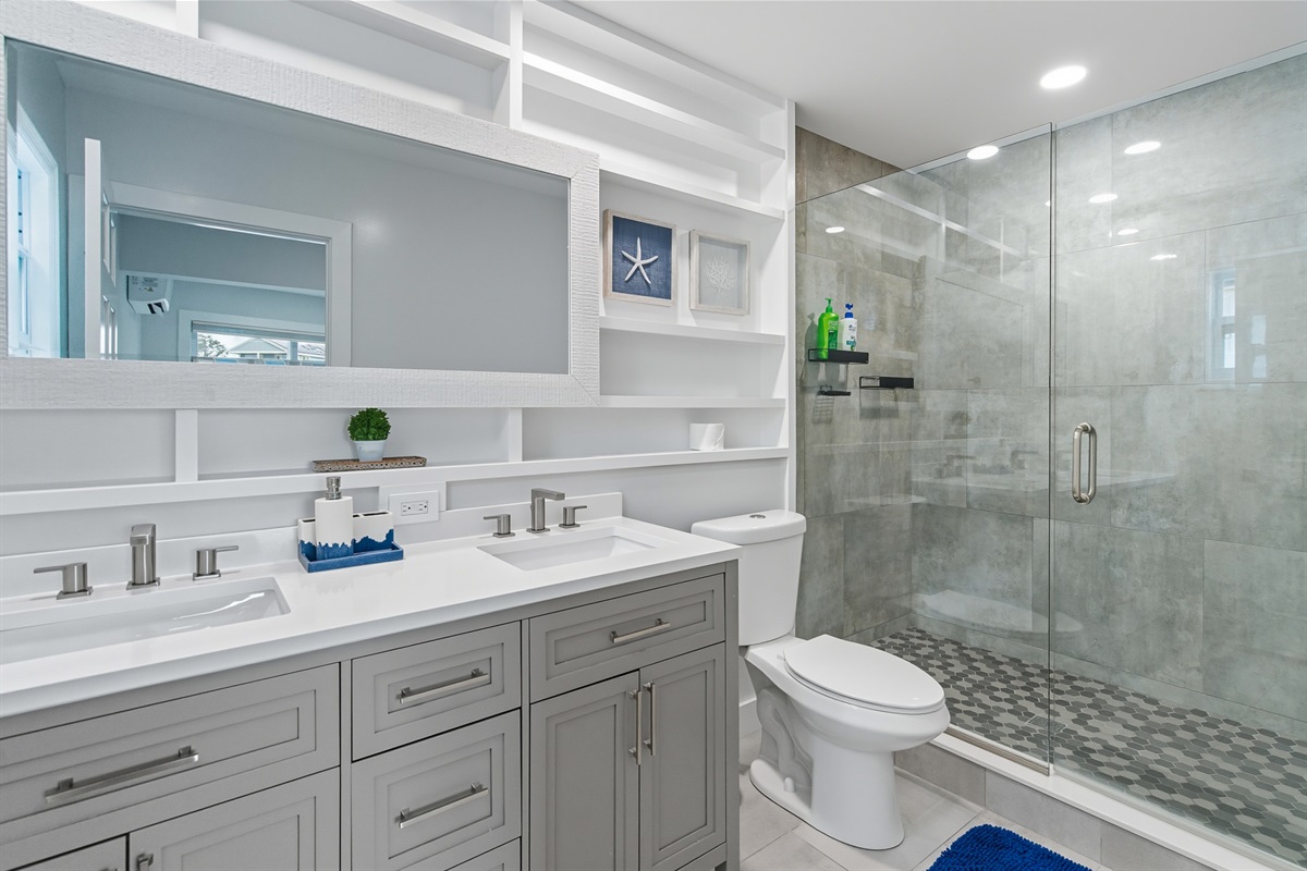 The ground floor master en suite is large and offers dual vanities.