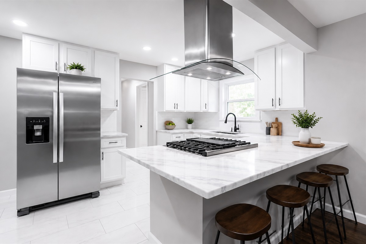 Fully updated open-concept kitchen with oversized island, gas cooktop, and sleek modern finishes throughout