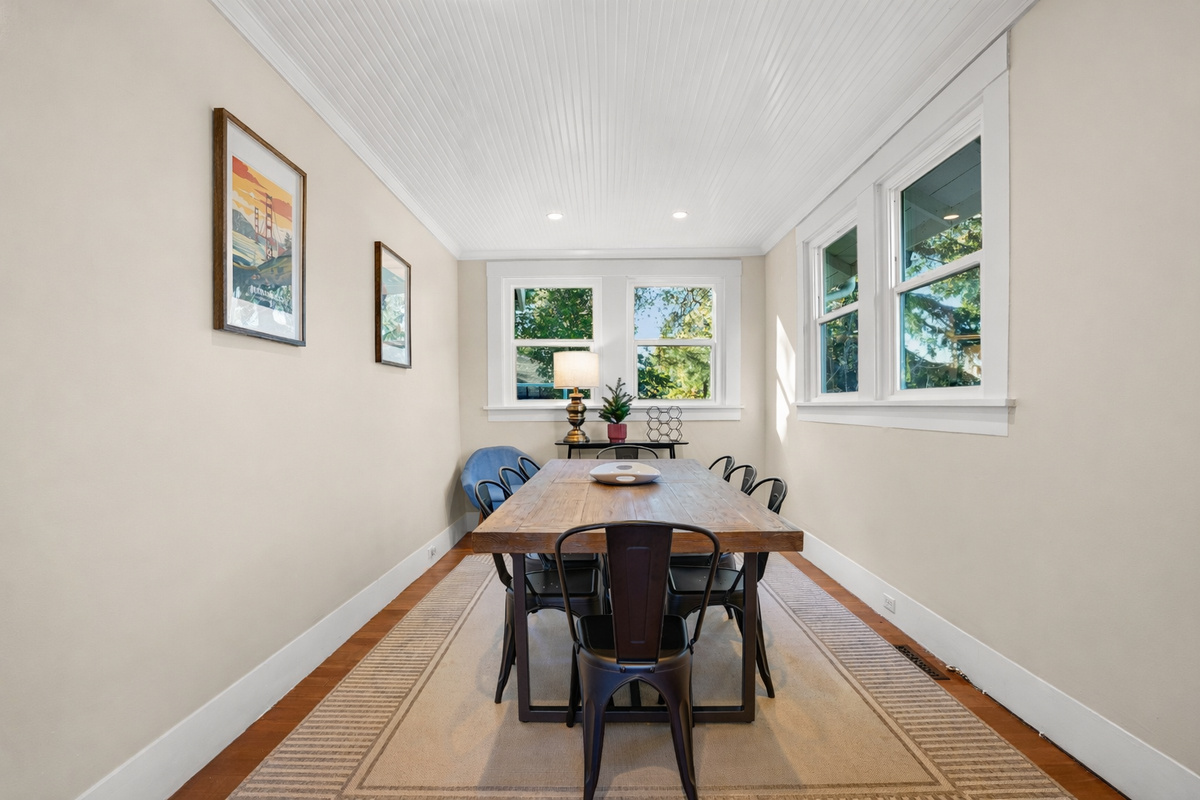 Gather together around the spacious dining table, which comfortably seats 8 guests and can be expanded to accommodate even larger groups. It's the perfect space for shared meals, celebrations, and making memories together.