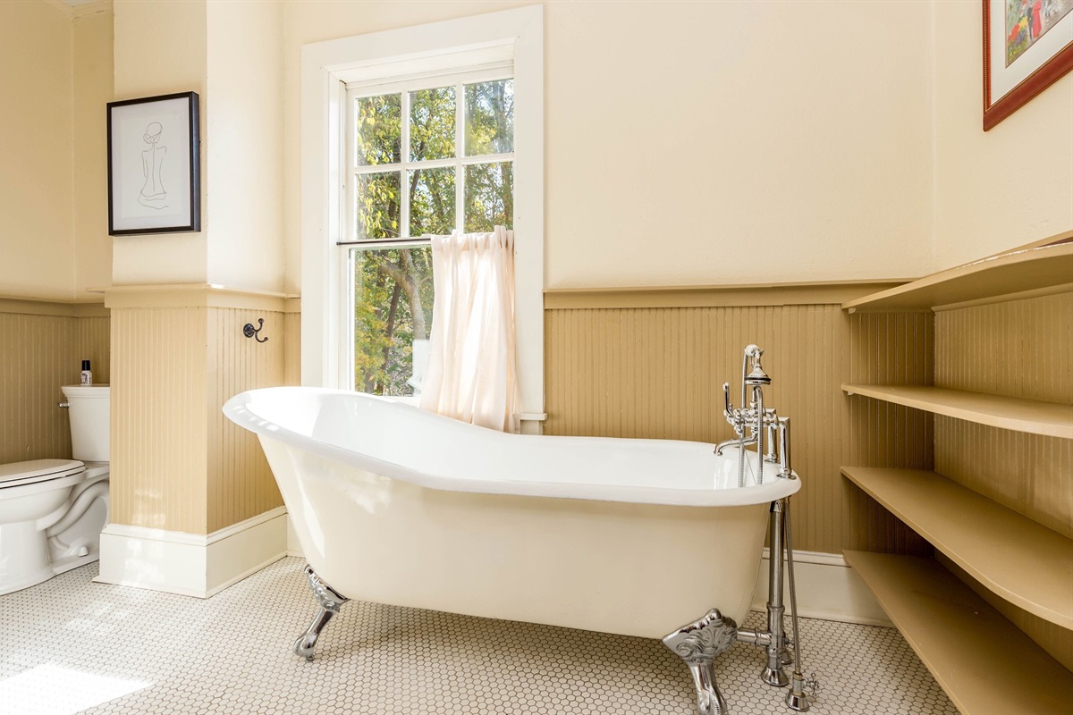 Claw foot bathing tub in upstairs bathroom