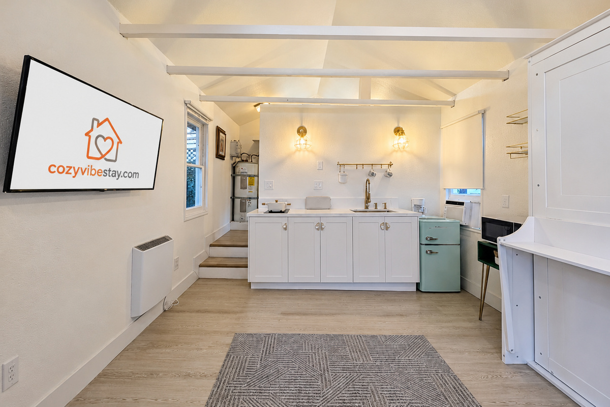 Open-concept studio with kitchenette and Smart TV.