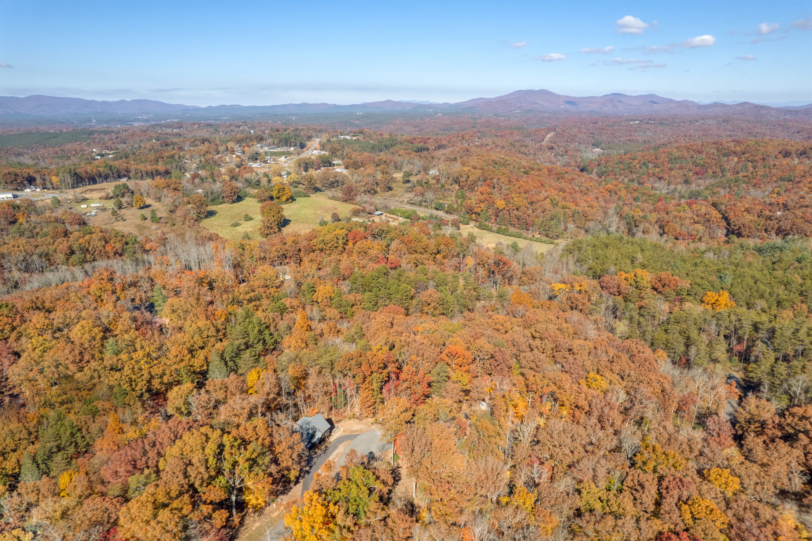 Aerial view of cabin and fall foilage