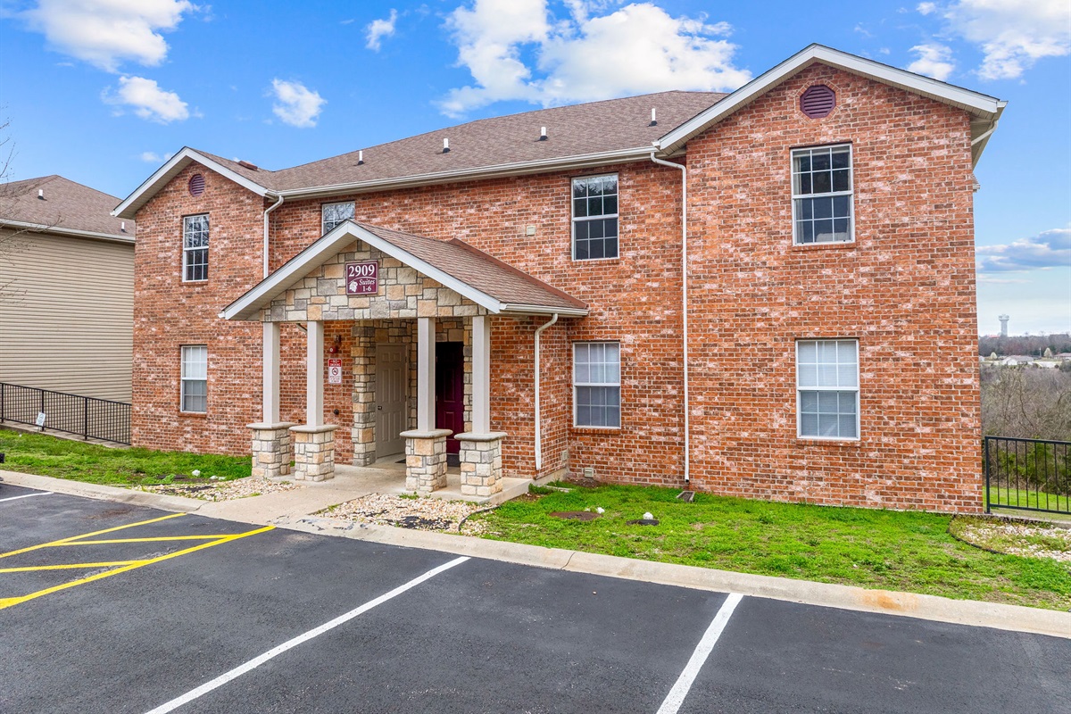 Front exterior of the building with parking