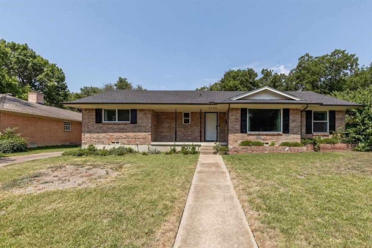 Side view of home, parking available in the drive way and up to for spots behind the home or additional space on the street