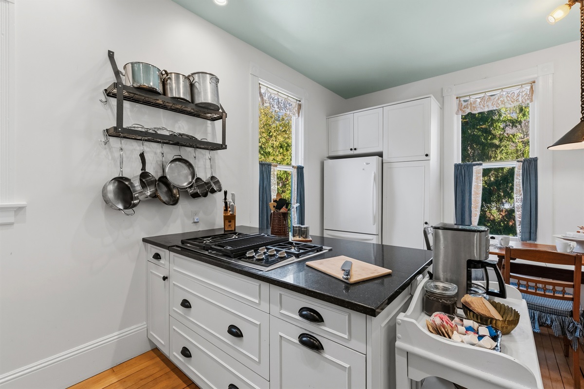 Farmhouse kitchen w/ open shelving & rustic accents