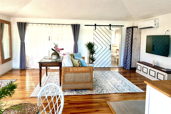 This is the main room of the 2nd level we call the Coral Suite. We lived here when we reno'd the lower level. Very spacious, pull out couch, table to work. Our favorite part is the teak flooring. We are slightly obsessed with teak and hardwoods;)
