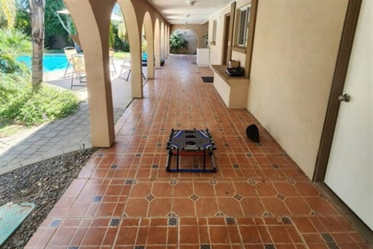 This breezy covered patio with classic tile flooring is ideal for sipping morning coffee, lounging in the shade, or enjoying the desert breeze.