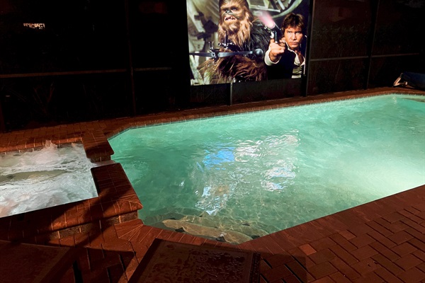 Watch TV And Movies On The Poolside Theater