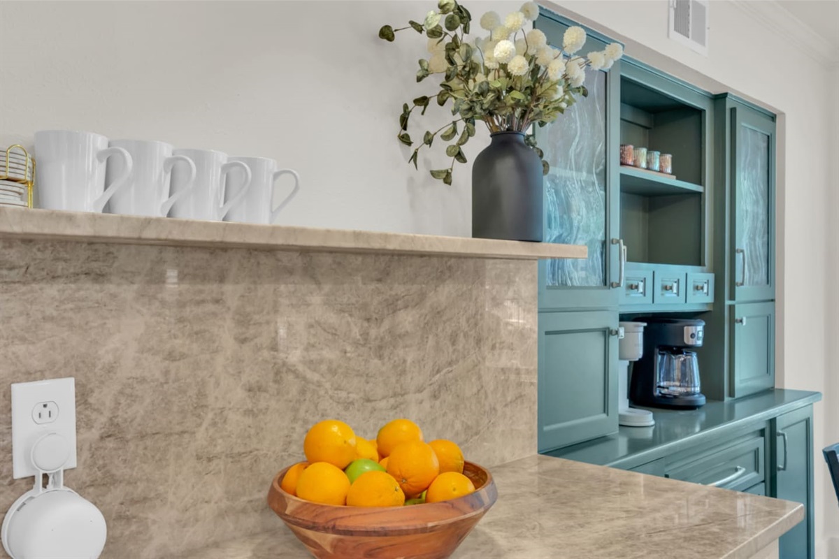 Coffee bar with mugs and a fully equipped setup, perfect for morning routines with both drip and Keurig coffee options.