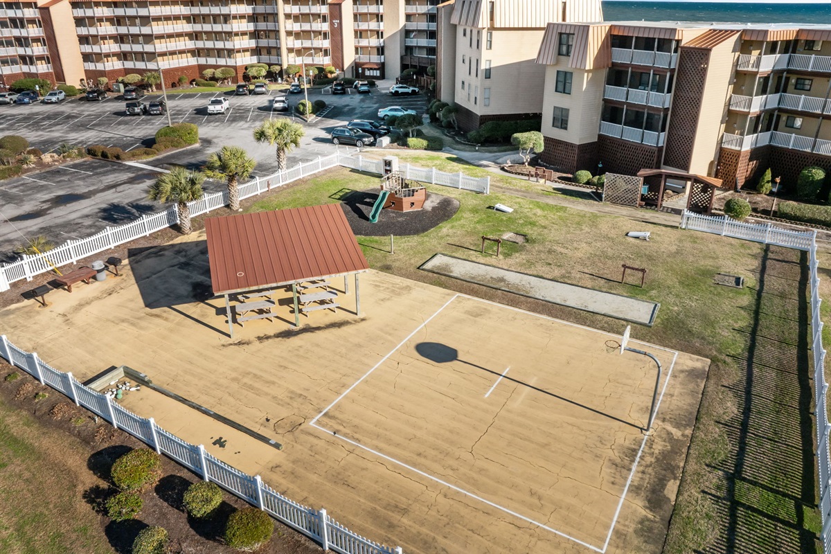 Shared outdoor amenities include a picnic pavilion, basketball court, and open green space&mdash;ideal for family time and relaxed afternoons at Topsail Dunes