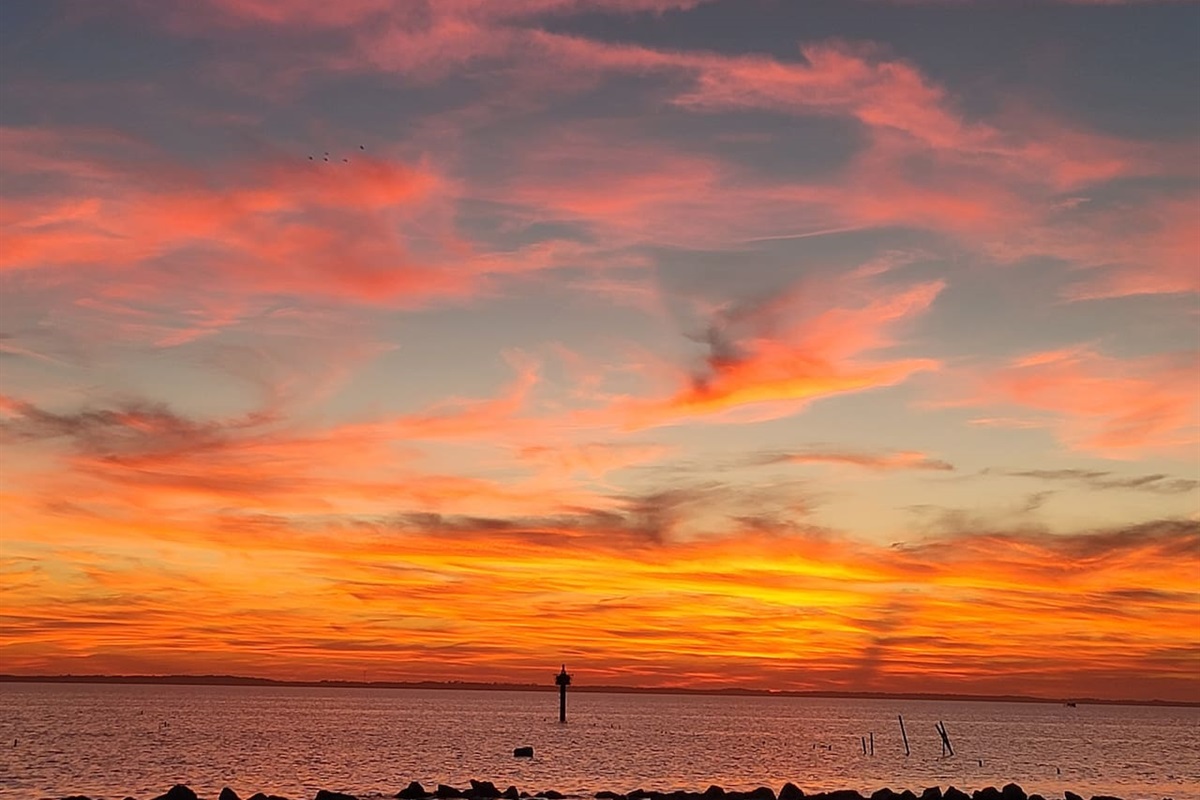Amazing colors at sunset from Corolla Park across the street. 