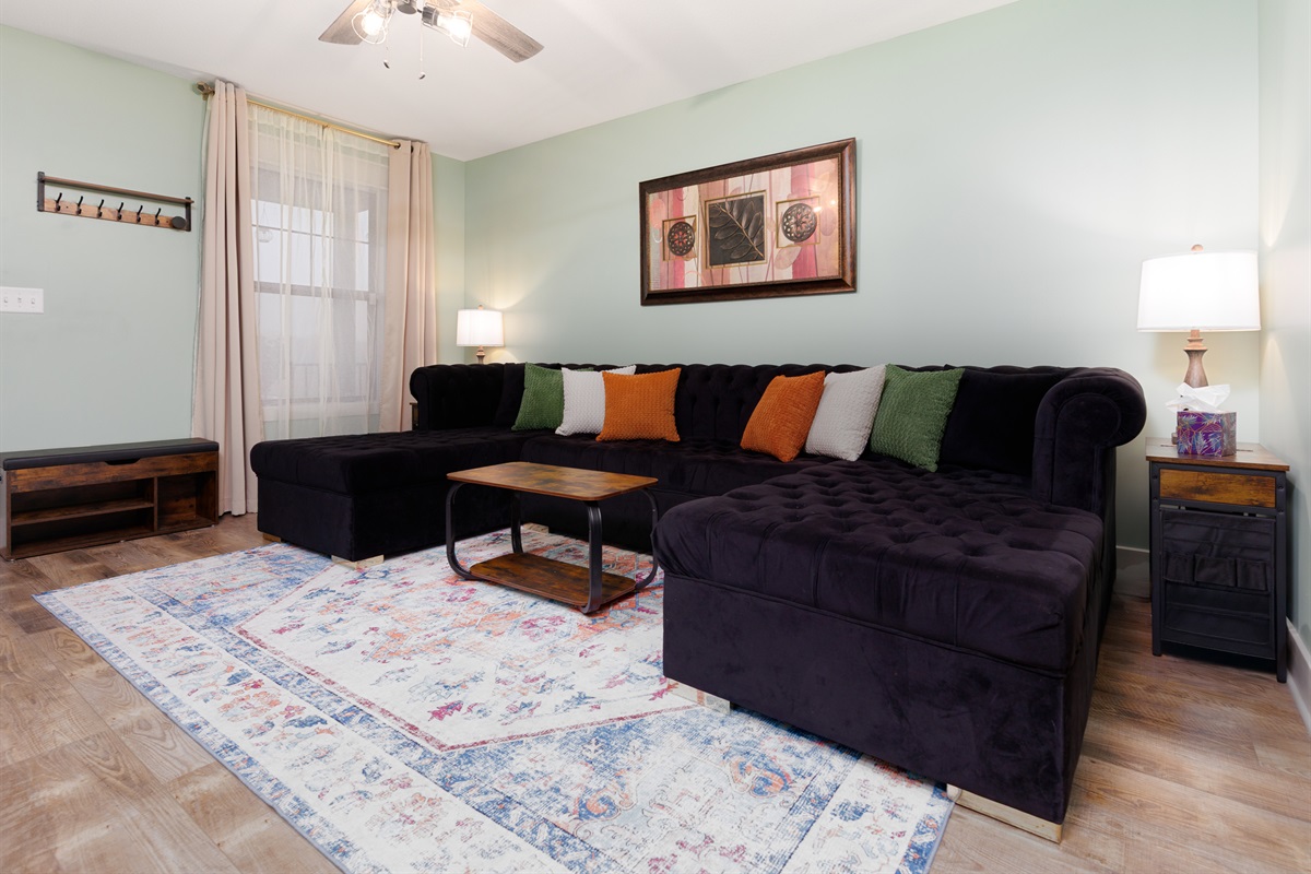 Inviting living room designed for comfort and connection, creating an ideal setting to unwind after a full day.