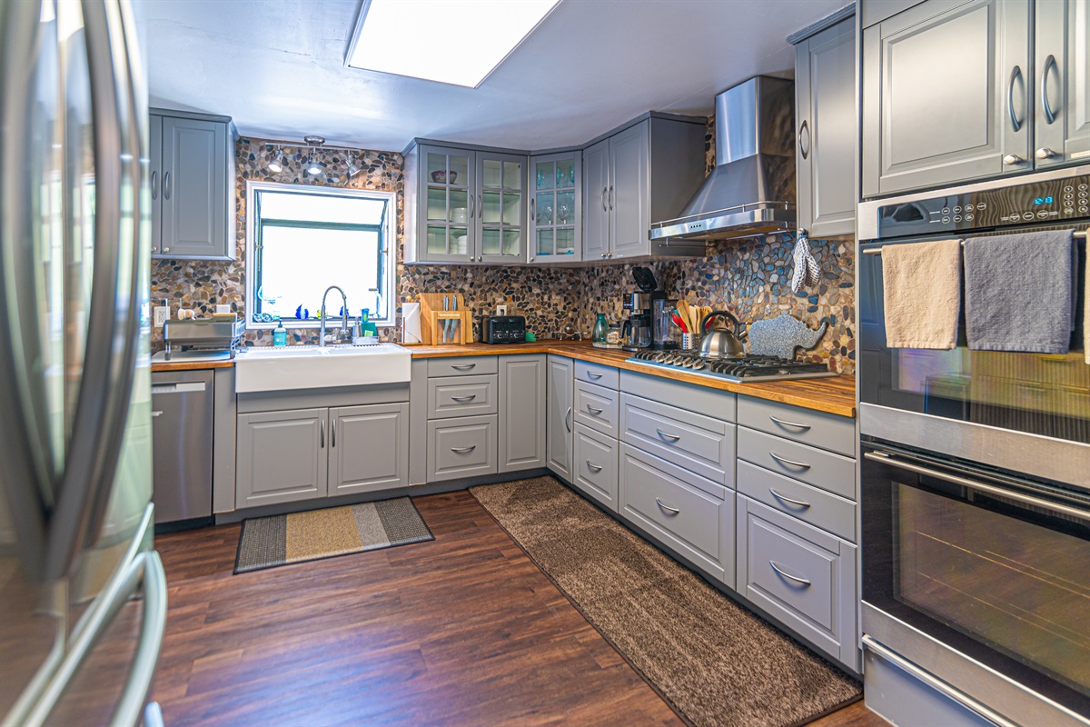 The fully equipped kitchen is designed for effortless vacation dining, featuring modern appliances, ample counter space, and everything needed to prepare anything from morning coffee to family feasts.