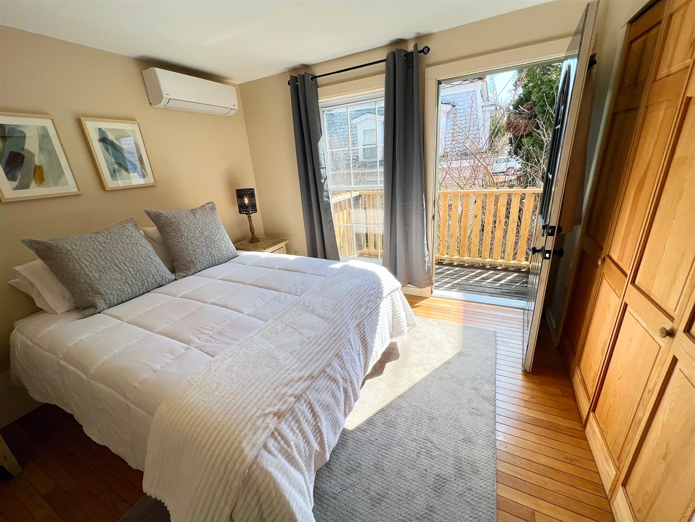 The primary bedroom features a plush queen memory foam mattress for a premium sleep experience. Balcony!