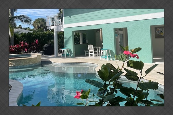 Enormous back yard with pool, spa, double lanai and grilling station