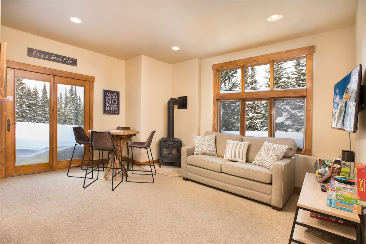 Lower level living area with sliding glass door to access outside