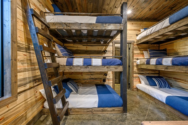 Rustic luxury meets cozy cabin vibes in this designer bunk suite.