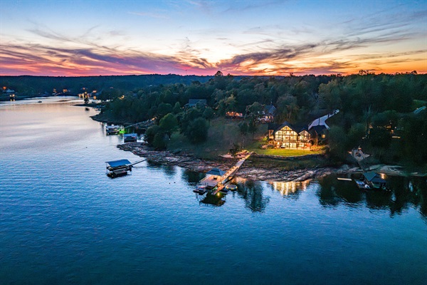 The calm of twilight settles — boats docked, dinner done, and peace stretching across the water.