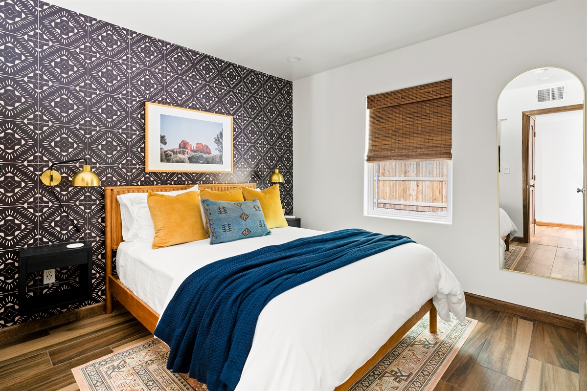 Perfect setup for a relaxing stay with a queen bed and soft bedding.