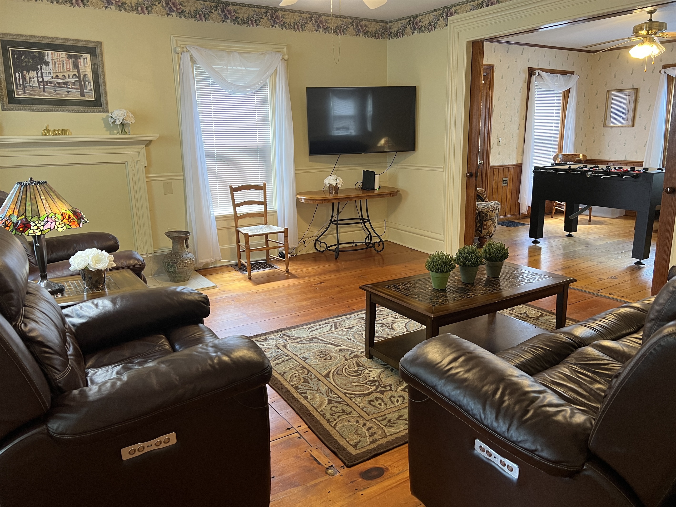 The Federal House living room with large smart TV.