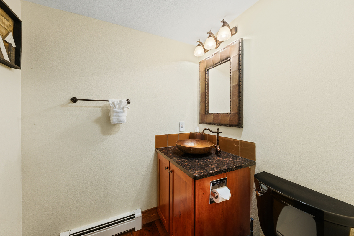 Half bathroom on main level just off living room. 
