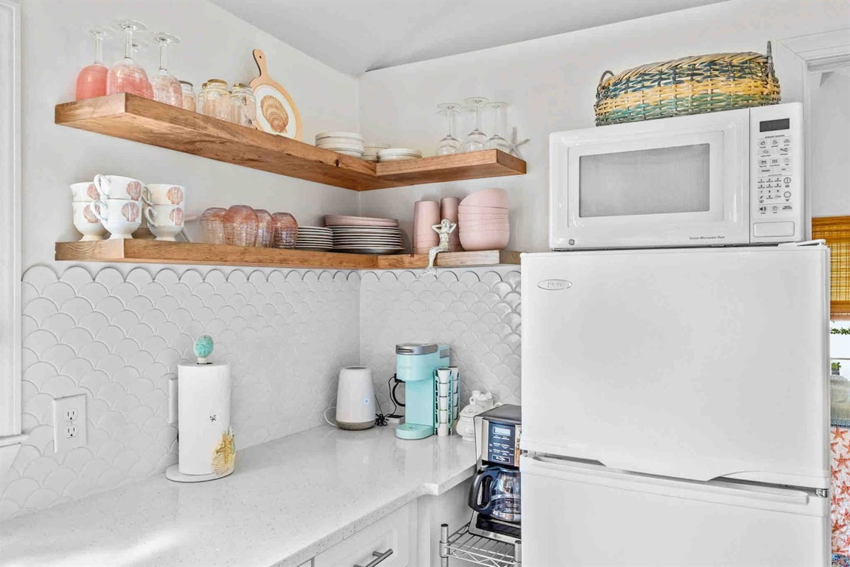 Beautifully staged floating shelves with plenty of dishes for all guest. Both a Keurig and standard drip coffee maker are provided!