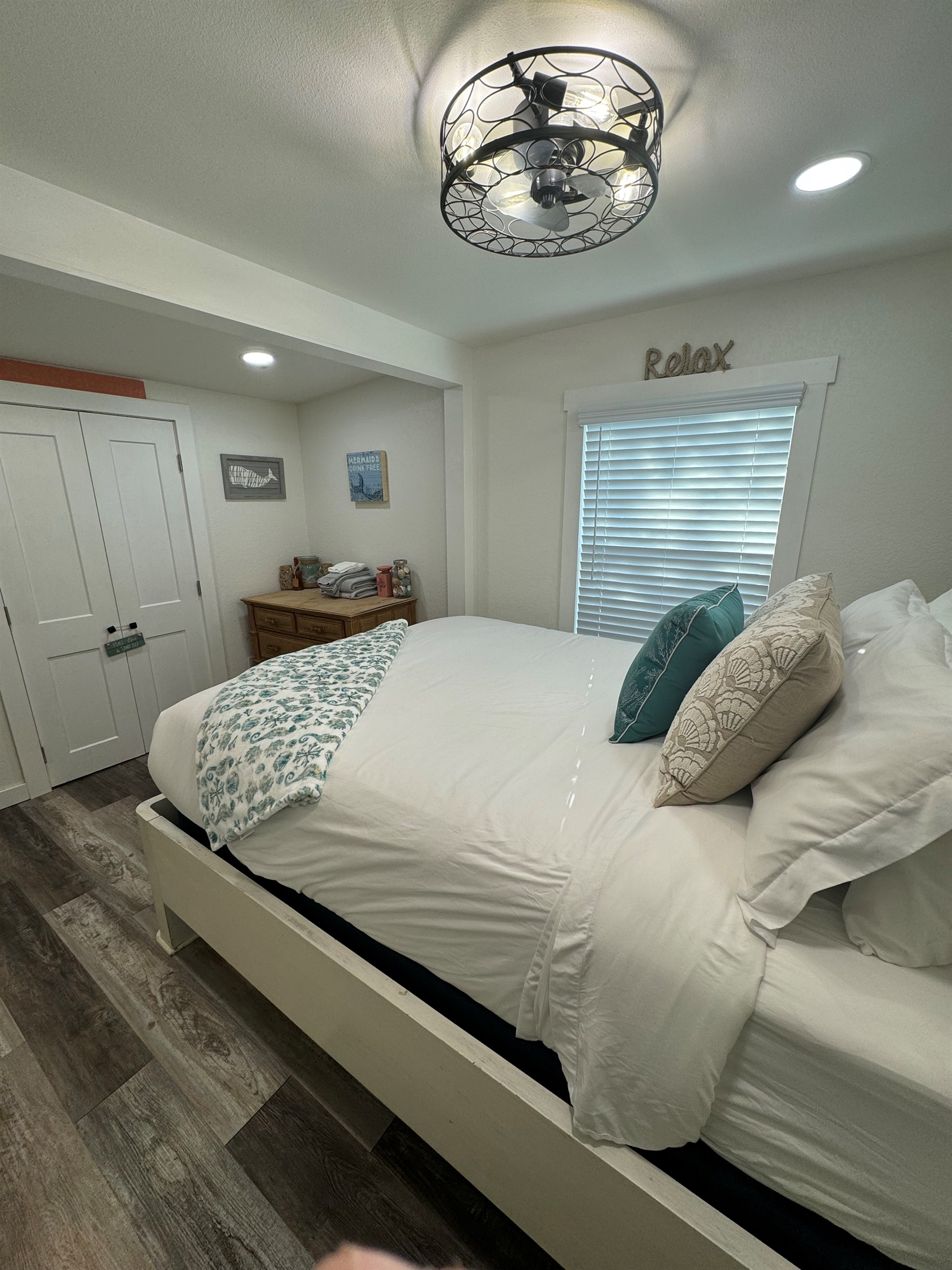 Bedroom with queen bed and smart tv