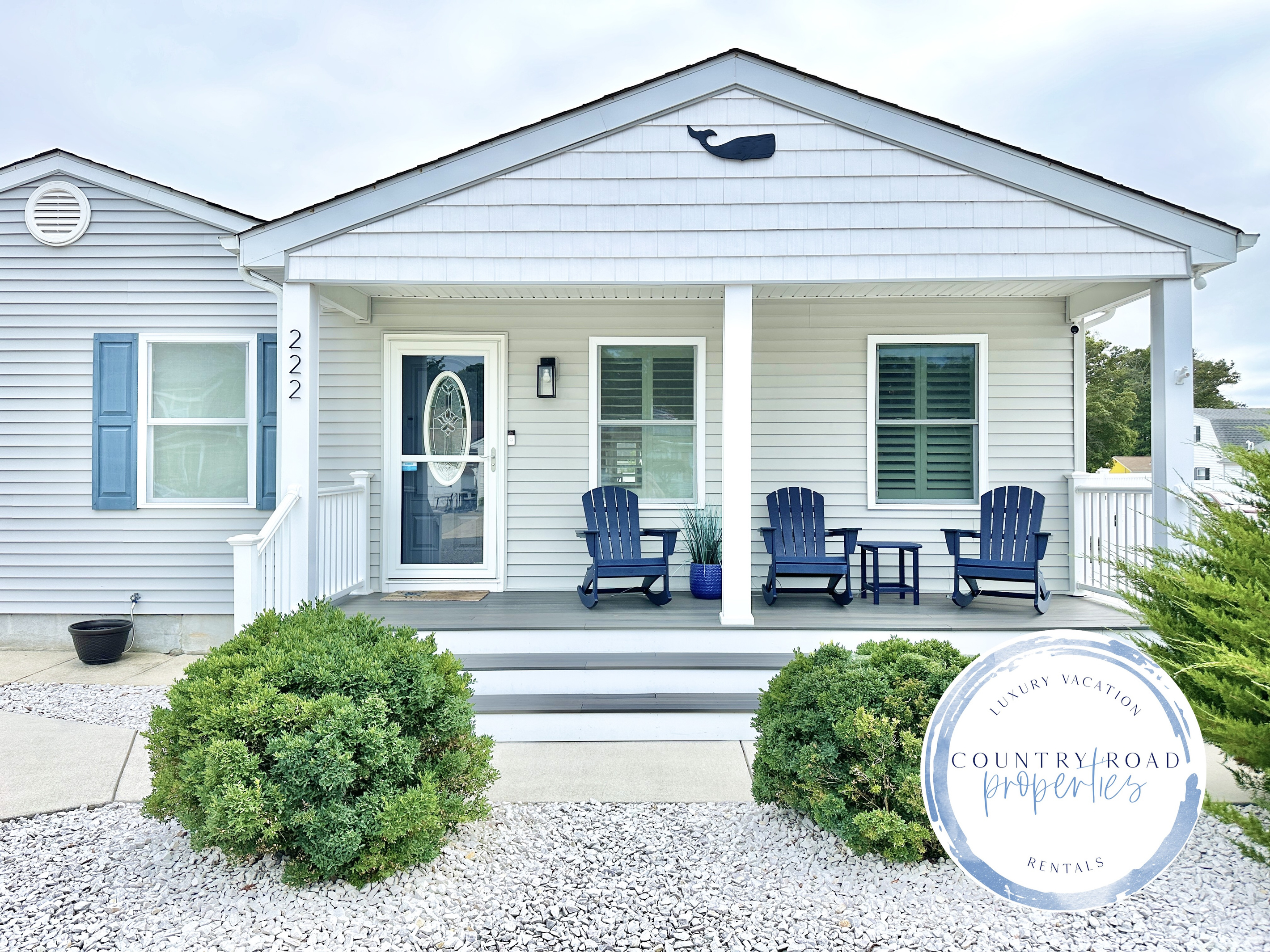 Welcome to your coastal escape, featuring a charming covered front porch with comfortable Adirondack rockers. This inviting entrance is the perfect spot to enjoy your morning coffee or feel the ocean breeze while taking in the quiet neighborhood views.
