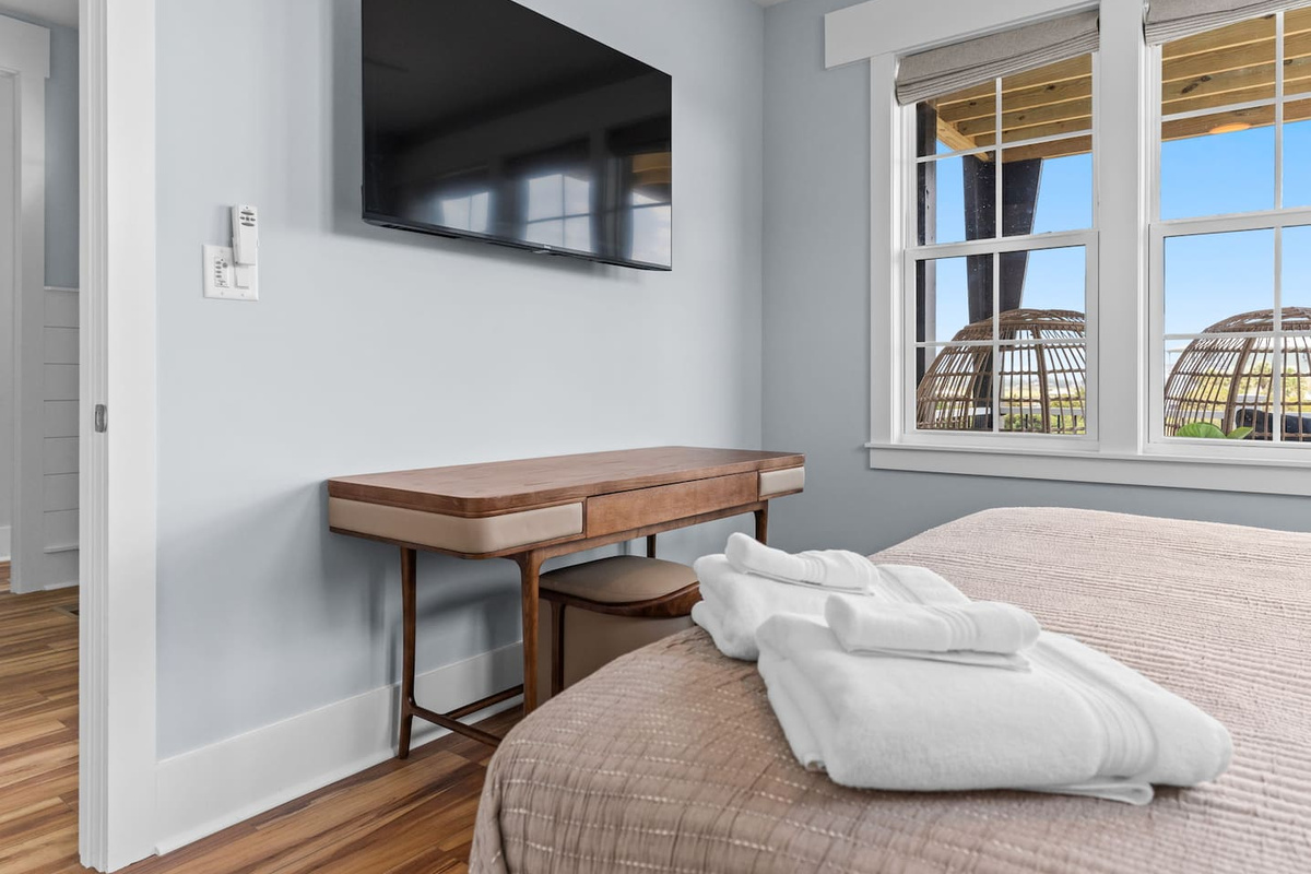 A space to work, relax, and recharge. Enjoy a dedicated desk workspace and 55-inch smart TV in this comfortable bedroom retreat.