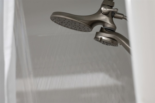 Relaxing rain shower head in the hallway bathroom