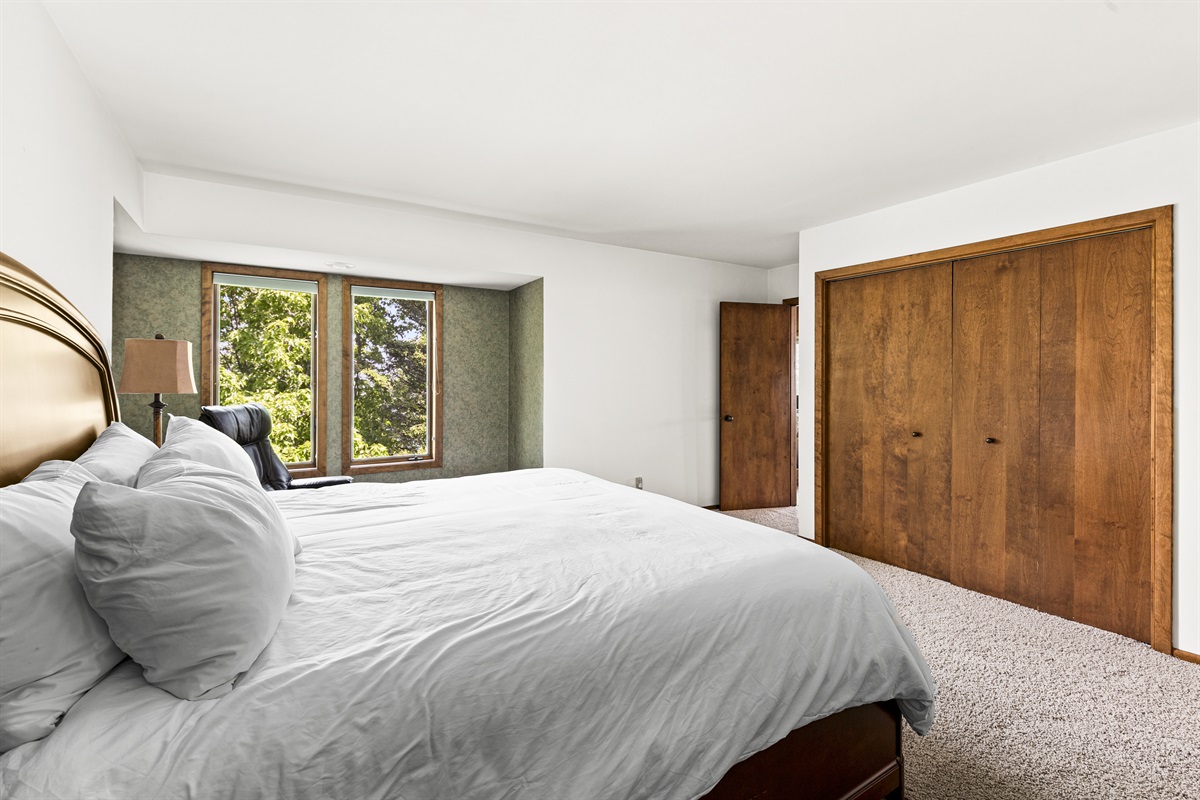 Upper level king bedroom connected to the bathroom.